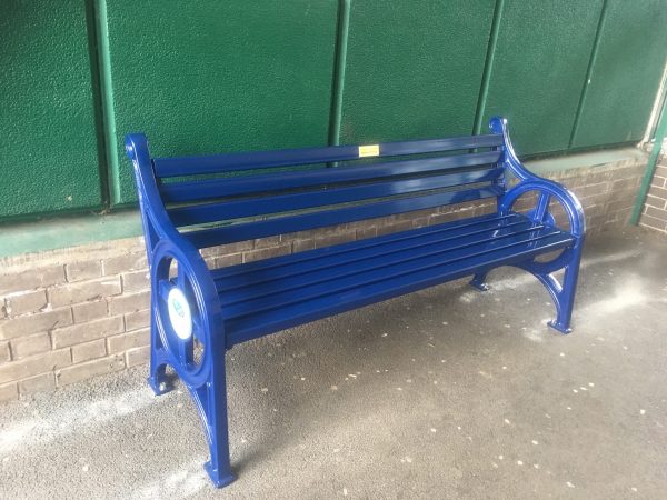 Metal bench with vandal proof slat and sign Bridgford 1