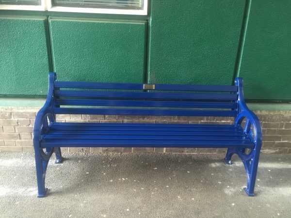 Metal bench with vandal proof slat and sign Bridgford 2